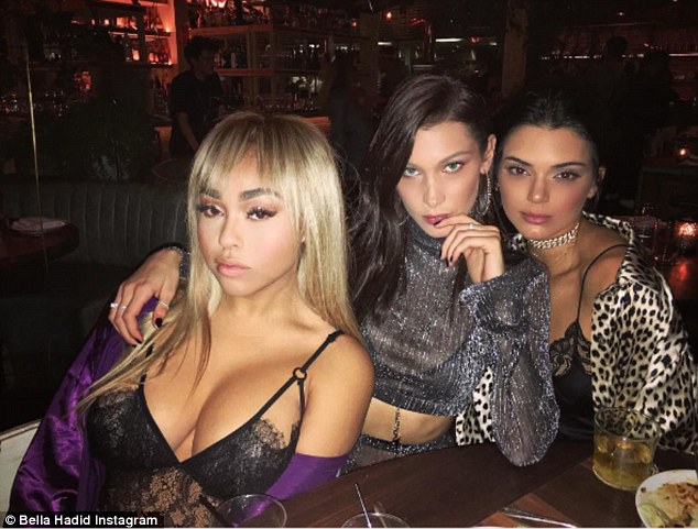 ‘Happiest New Year!’ Bella Hadid shares selfie blowing on party horn as she rings in 2017 with Kendall Jenner and Jordyn Woods