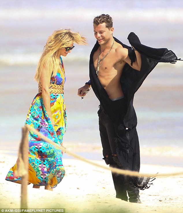 Paris Hilton cuddles up to shirtless Mystery Man during romantic date in Mexico