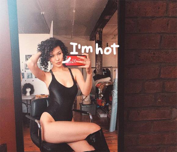 Bella Hadid Shows off Curls & A Sexy Slice of Thigh