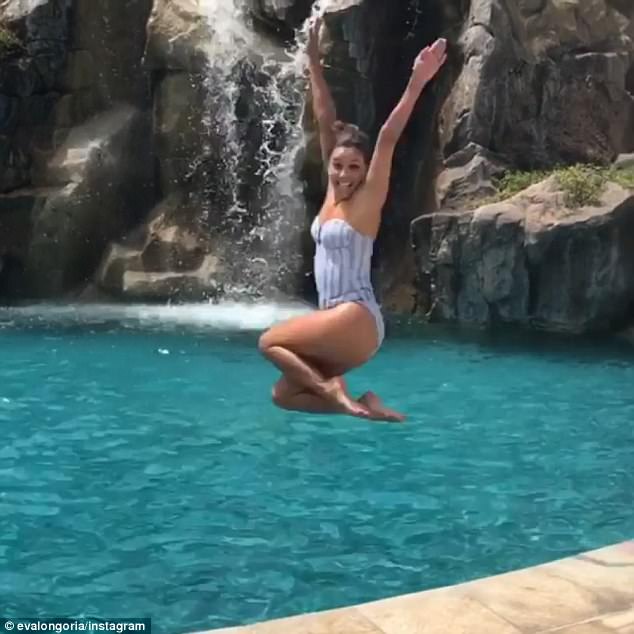 Eva Longoria shows off her fab figure as she dives into the pool on Hawaiian getaway