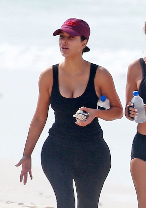 Kim Kardashian’s bum still takes centre stage even when she’s dressed in gym gear for beach work out