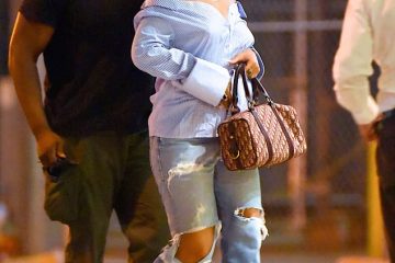 Smart-casual, Rihanna style! Pop star rocks an off-the-shoulder shirt and ripped jeans on night out in Manhattan