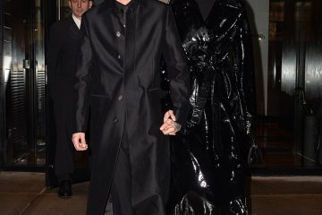 Gigi Hadid and Zayn Malik show off Futuristic Fashion sense in matching long black coats as they Celebrate Singer’s 25th Birthday