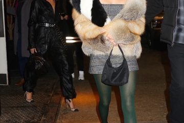 Nineties inspired! Kendall Jenner pairs plaid mini dress with green tights and a colorful fur coat