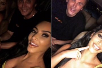 Kim Kardashian puts on a busty display in plunging yellow dress while out with friends