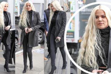 Khloe Kardashian flashes hint of her midriff all Black ensemble with cascading Platinum tresses